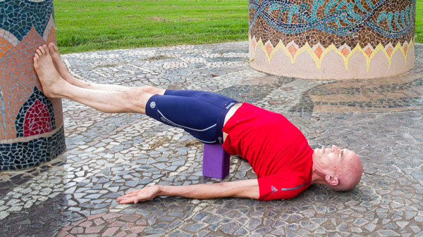 Bridge pose with a block under sacrum