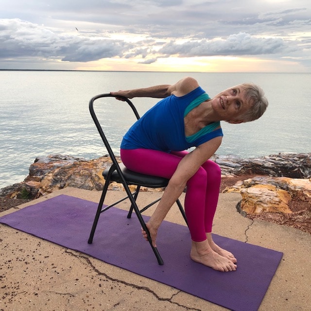 Seated chair twist by the sea, a supported twist for the lower and middle back