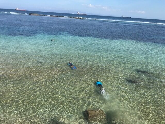 Snorkelling in clear water inside the reef in front of Pondok Pisang, Candidasa