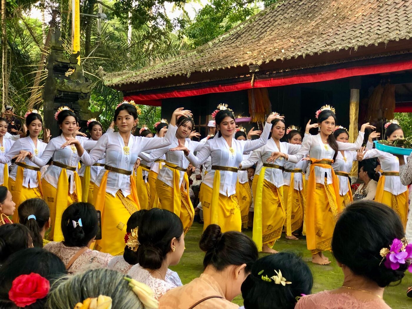 Young Balinese women dancing in procession dress at the seafront temple near Sengkidu