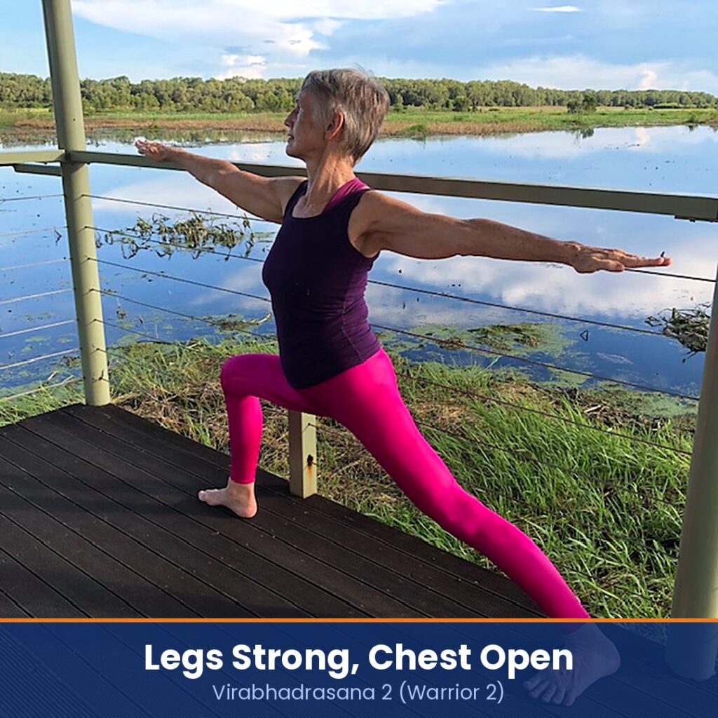 Chris Lalor in Virabhadrasana 2, Warrior 2, on a timber deck beside a wetland, captioned legs strong, chest open