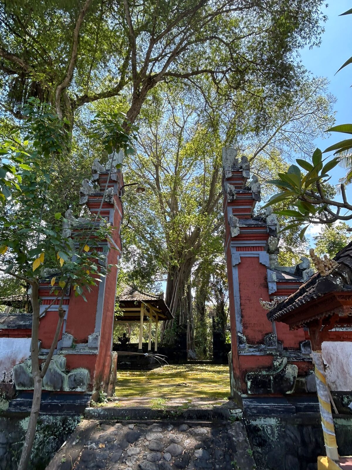A brick and stone temple gateway in the gardens near Pondok Pisang, Candidasa, Bali