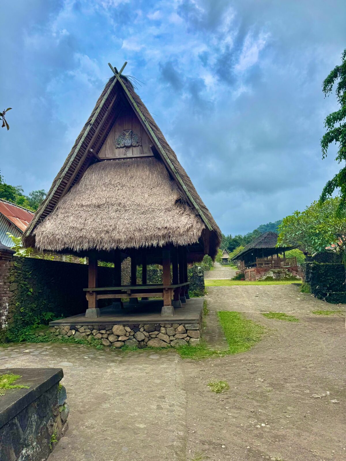A traditional thatched rice barn raised on stone posts in Tenganan village, East Bali