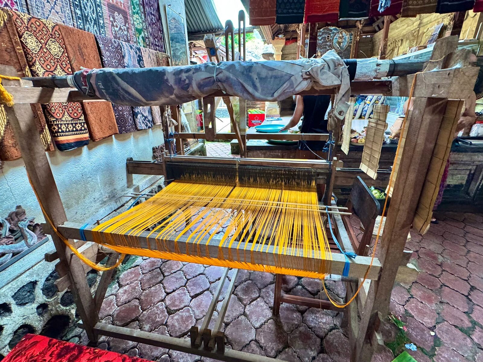A backstrap loom set up for geringsing double ikat weaving in Tenganan village, Bali