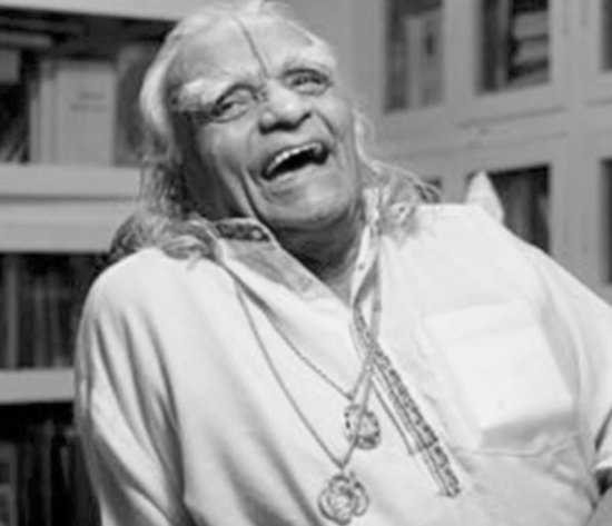 BKS Iyengar laughing, black and white portrait of the founder of Iyengar yoga