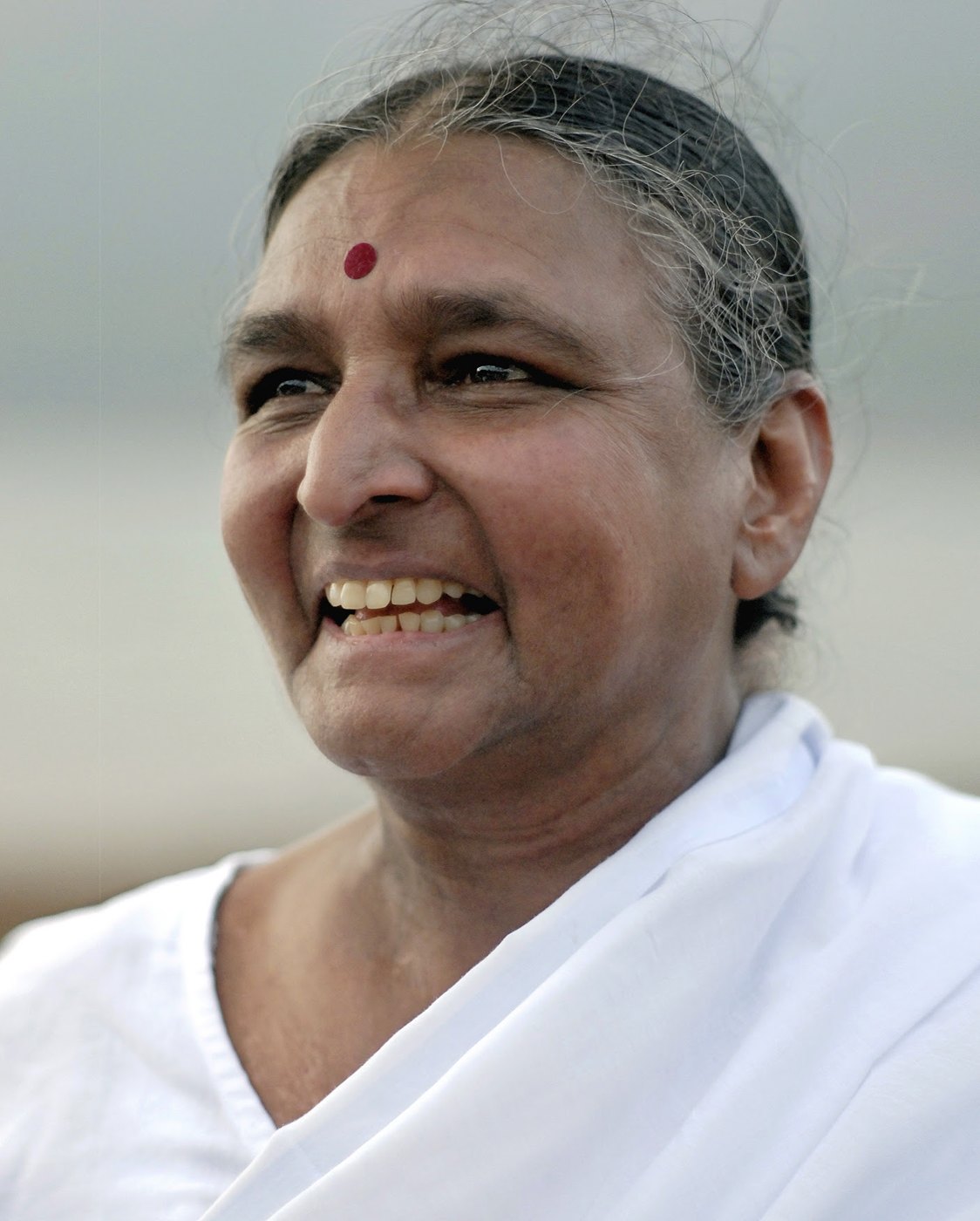 Geeta Iyengar laughing warmly, daughter of BKS Iyengar and a leading teacher of Iyengar yoga