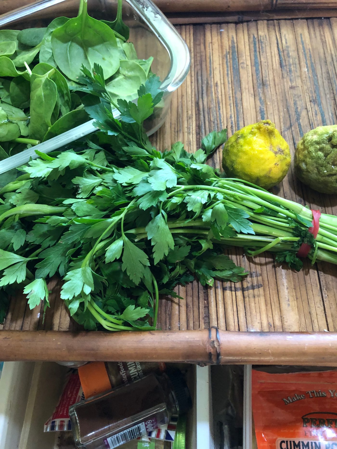 Baby spinach, fresh coriander and limes to finish a jackfruit curry