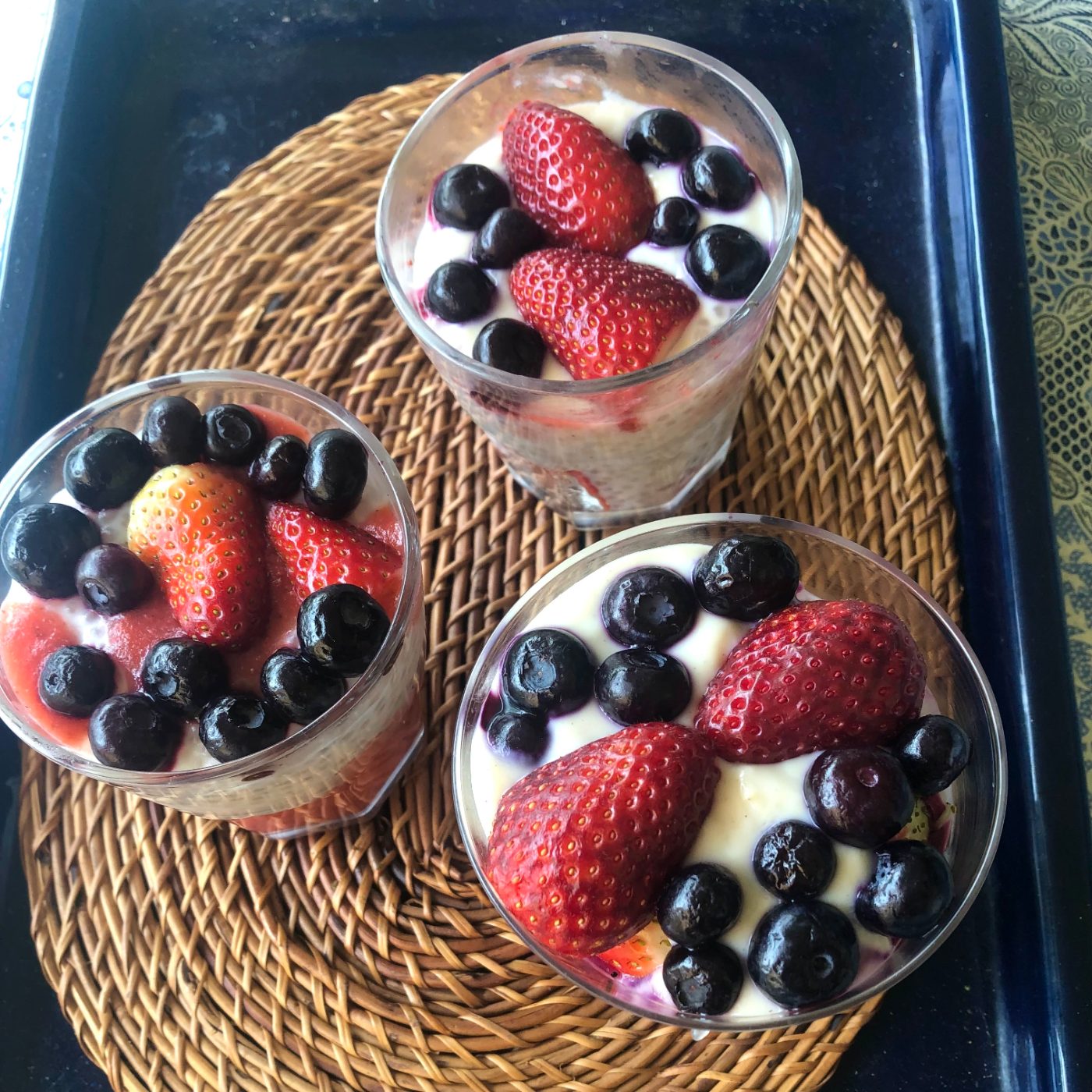 Three glasses of strawberry tapioca pudding chilled and ready to serve